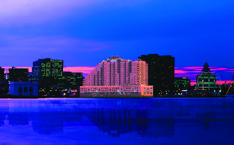 Dockside building at night against Philadelphia skyline