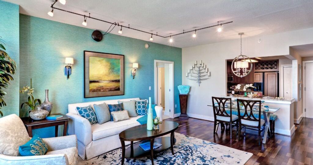 Condo interior at The Residences at Dockside. Lovely living room with blue and tan walls.