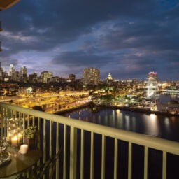 View from private terrace overlooking Penn's Landing and Philly Skyline at Night.