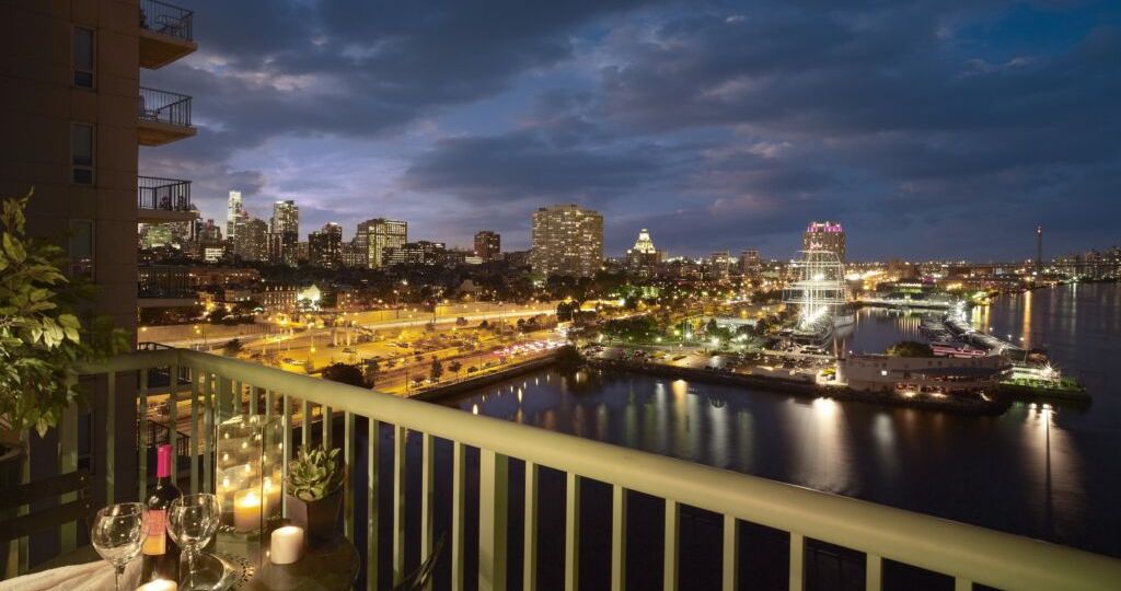 View from private terrace overlooking Penn's Landing and Philly Skyline at Night.