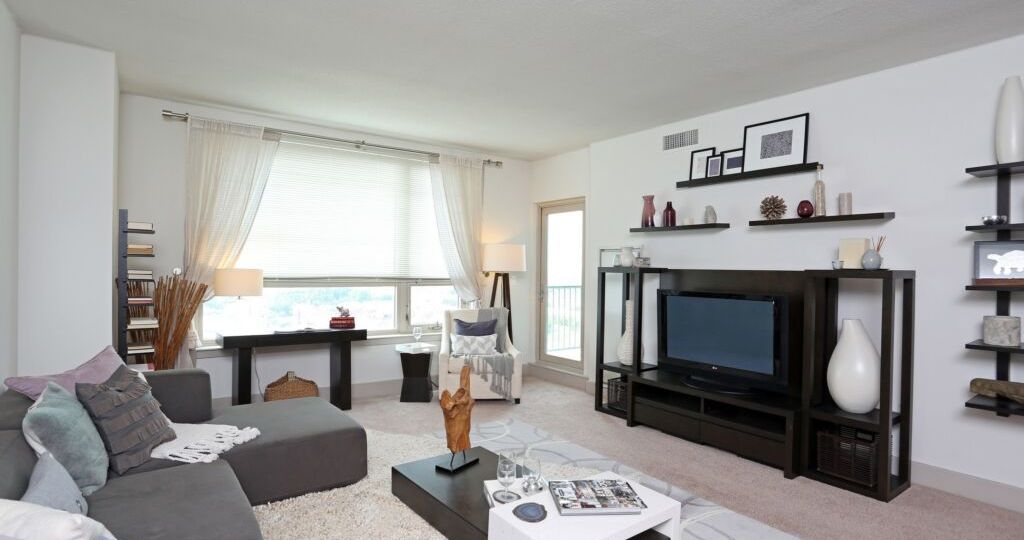 Dockside Condo Living Room Interior. Modern design with white walls and black & gray finishes.