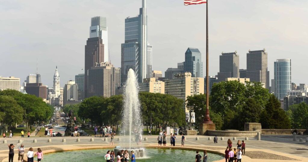 People around the Fountain near Philadelphia Museum of Art and Philadelphia view at the background.