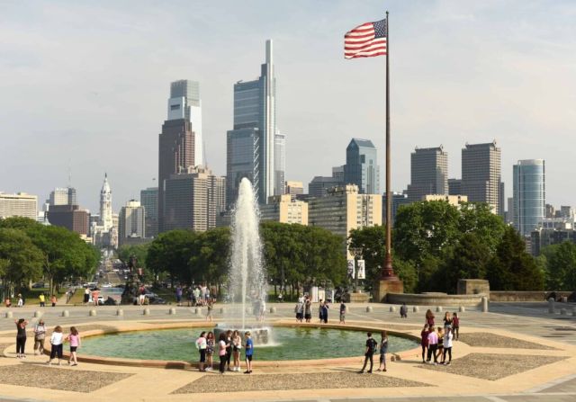 People around the Fountain near Philadelphia Museum of Art and Philadelphia view at the background.