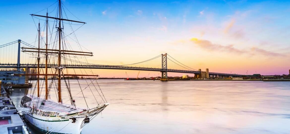 sunset over philly bridge