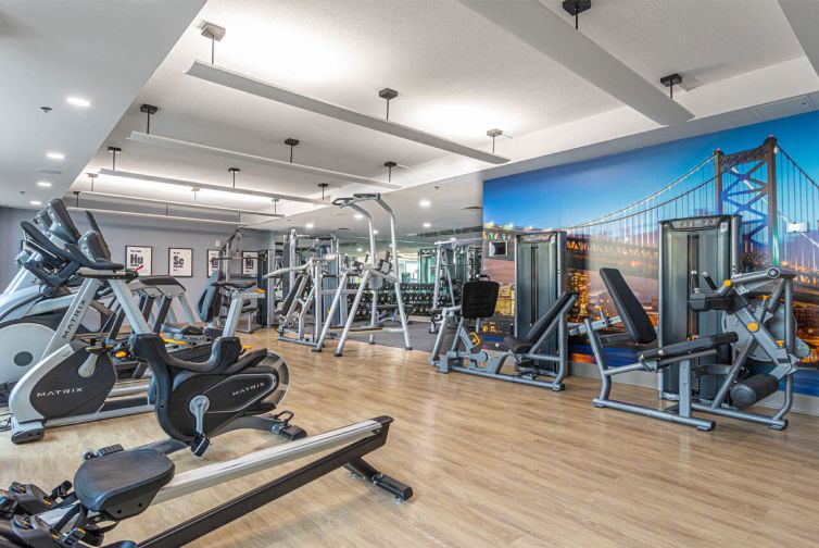 Luxury fitness center with cardio and strength training machines at Philadelphia condos for sale