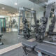 Free weights with large mirror in spacious condominium fitness center